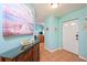 Stylish foyer boasts tile flooring and charming beach-themed decor; creates a welcoming entrance at 19937 Gulf Blvd # B-3, Indian Shores, FL 33785