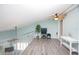 Spacious living room featuring modern flooring, a ceiling fan, and a charming seating area with ample natural light at 19937 Gulf Blvd # B-3, Indian Shores, FL 33785