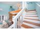 Open living space with stairs leading to loft above kitchen area at 19937 Gulf Blvd # B-3, Indian Shores, FL 33785