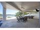 Inviting outdoor seating with ceiling fans, BBQ grills and waterfront views at 19937 Gulf Blvd # B-3, Indian Shores, FL 33785