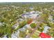 Aerial view of a property situated on a tree-lined street in a residential area, indicated by an arrow marker at 2505 53Rd S St, Gulfport, FL 33707