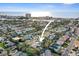 An aerial view highlights the location of the property within the community, nearby the ocean and distant cityscapes at 266 44Th Ave, St Pete Beach, FL 33706
