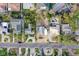Bird's-eye view of a property highlighting the lot, nearby houses, landscaping, and a glimpse of a shared swimming pool at 266 44Th Ave, St Pete Beach, FL 33706