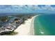 Breathtaking aerial view of pristine beach with clear turquoise waters and scenic coastal landscape at 266 44Th Ave, St Pete Beach, FL 33706