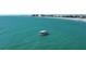 Expansive ocean view featuring a private charter boat in the turquoise sea near the shore at 266 44Th Ave, St Pete Beach, FL 33706