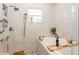 Elegant bathroom with marble tile and a sleek, contemporary design at 2660 Powell Ln, Tarpon Springs, FL 34688