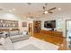 Inviting living room featuring hardwood floors, wet bar, and a cozy sectional sofa at 2660 Powell Ln, Tarpon Springs, FL 34688
