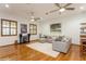 Cozy living room with hardwood floors, a comfortable sectional sofa, and natural light at 2660 Powell Ln, Tarpon Springs, FL 34688