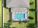 Aerial top-down view of a home featuring a screened pool at 2911 Silva Wood Dr, Valrico, FL 33596