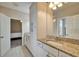 Bathroom featuring a granite vanity top, sink, and storage cabinets at 2911 Silva Wood Dr, Valrico, FL 33596