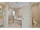 Bathroom with a glass shower and soaker tub at 2911 Silva Wood Dr, Valrico, FL 33596