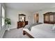 This well-lit bedroom offers a comfortable bed, natural lighting, and plenty of closet space at 2911 Silva Wood Dr, Valrico, FL 33596