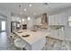 Bright, modern kitchen features stainless steel appliances, a large island, and stylish pendant lighting at 2911 Silva Wood Dr, Valrico, FL 33596