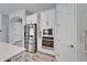 Gourmet kitchen showcasing stainless steel appliances, white cabinets, and sleek countertops at 2911 Silva Wood Dr, Valrico, FL 33596