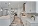 Spacious kitchen featuring stainless steel appliances, sleek white cabinetry, and modern countertops at 2911 Silva Wood Dr, Valrico, FL 33596