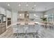 Kitchen boasts stainless steel appliances, a large island with bar seating, and ample counter space at 2911 Silva Wood Dr, Valrico, FL 33596