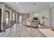 Light-filled living room offers open layout, tile floors, and seamless transition to outdoor patio at 2911 Silva Wood Dr, Valrico, FL 33596