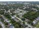 An aerial shot showcasing a lush, tree-filled neighborhood at 3184 Cypress Green Dr, Palm Harbor, FL 34684