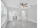 Bright bedroom featuring tile floors, ceiling fan, and ensuite bath at 3184 Cypress Green Dr, Palm Harbor, FL 34684