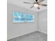 This bedroom has large window, providing great natural light at 3184 Cypress Green Dr, Palm Harbor, FL 34684