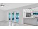 Bright living area with quartz countertops, stainless steel appliances, and grey cabinetry at 3184 Cypress Green Dr, Palm Harbor, FL 34684