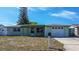 Charming single-story home with a well-maintained front lawn and attached garage, offering comfortable living at 3438 Bigelow Dr, Holiday, FL 34691