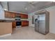 Well-equipped kitchen featuring stainless steel appliances, oak cabinets, and durable tile flooring, ideal for culinary enthusiasts at 3438 Bigelow Dr, Holiday, FL 34691