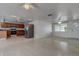 Inviting living area showcasing a seamless flow into the kitchen, complete with stainless appliances and ample natural light at 3438 Bigelow Dr, Holiday, FL 34691