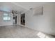 Open living room showcasing tile floors and windows letting in natural light at 3438 Bigelow Dr, Holiday, FL 34691