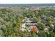 Aerial view of a well-maintained community with lush greenery, mature trees and a private parking at 4031 Bluff Oak Ct, Palm Harbor, FL 34684