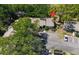 The building has a large parking lot and mature landscaping around it at 4031 Bluff Oak Ct, Palm Harbor, FL 34684