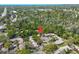 Aerial shot of a serene, well-maintained community featuring mature trees, lush landscaping, and ample parking at 4031 Bluff Oak Ct, Palm Harbor, FL 34684