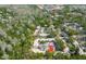 Aerial view highlighting mature trees, ample parking, and the peaceful setting of this property at 4031 Bluff Oak Ct, Palm Harbor, FL 34684