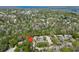 Aerial view of residences nestled among mature trees and lush landscape in desirable neighborhood at 4031 Bluff Oak Ct, Palm Harbor, FL 34684