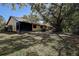 Home's backyard with tall trees shading the property at 4031 Bluff Oak Ct, Palm Harbor, FL 34684