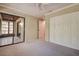 Bedroom with large closets, sliding glass door and neutral carpeting at 4031 Bluff Oak Ct, Palm Harbor, FL 34684