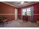 Bright bedroom with vintage desk, chair, and good natural light from the large window at 4031 Bluff Oak Ct, Palm Harbor, FL 34684