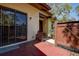 Cozy front patio with privacy fence and sliding glass door provides an intimate outdoor area at 4031 Bluff Oak Ct, Palm Harbor, FL 34684