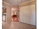 Hallway view into the kitchen and living room, showcasing a closet and hardwood floors at 4031 Bluff Oak Ct, Palm Harbor, FL 34684