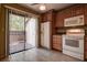 Bright kitchen featuring wooden cabinetry, a refrigerator and an oven with access to a patio at 4031 Bluff Oak Ct, Palm Harbor, FL 34684