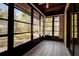 Screened lanai features views of a green, wooded backyard at 4031 Bluff Oak Ct, Palm Harbor, FL 34684