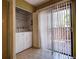 Functional laundry area featuring a washer, dryer, and sliding door access to the outdoors at 4031 Bluff Oak Ct, Palm Harbor, FL 34684