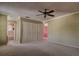 Spacious main bedroom includes ceiling fan, closet, and adjoining bathroom for added convenience at 4031 Bluff Oak Ct, Palm Harbor, FL 34684