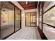 Enclosed patio features tile flooring and sliding glass doors, providing a bright and versatile space at 4031 Bluff Oak Ct, Palm Harbor, FL 34684