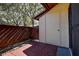 Enclosed outdoor patio features a textured brick floor, privacy fencing, and storage space at 4031 Bluff Oak Ct, Palm Harbor, FL 34684