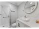 Bathroom featuring a modern vanity, vessel sink, and glass-enclosed shower with accessible grab bars at 4724 Michael Ct # 123, Tampa, FL 33614