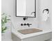 Stylish bathroom featuring an vessel sink with black hardware, and quartz countertop at 48 Sandpiper Rd, Tampa, FL 33609