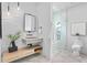 Modern bathroom featuring stylish vanity, lighting, and glass enclosed shower at 48 Sandpiper Rd, Tampa, FL 33609