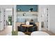 Stylish dining area with a chic blue tile backsplash, bar and seating for four at 48 Sandpiper Rd, Tampa, FL 33609