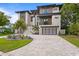 Modern home with a statement driveway, a two car garage, and manicured landscaping creating great curb appeal at 48 Sandpiper Rd, Tampa, FL 33609
